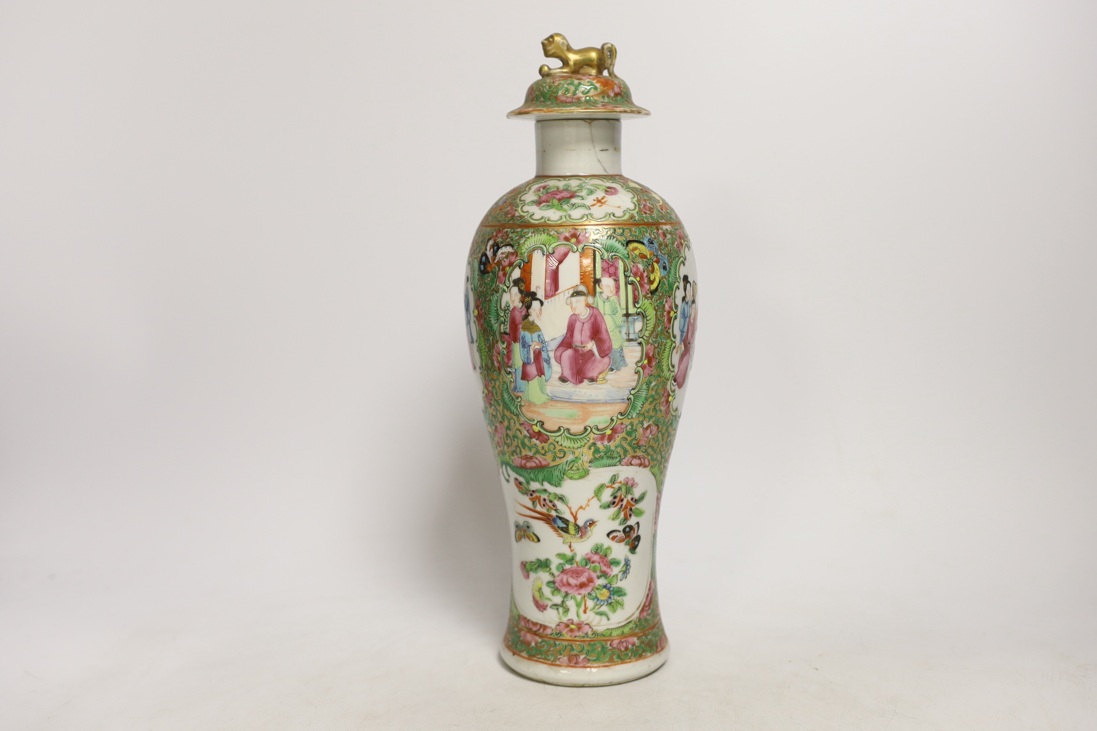 Chinese porcelain- a tall 19th century famille rose vase and cover, a famille rose jar, early 19th century probably made the Indian market, a famille noire jar and a Japanese vase, tallest 28cm high